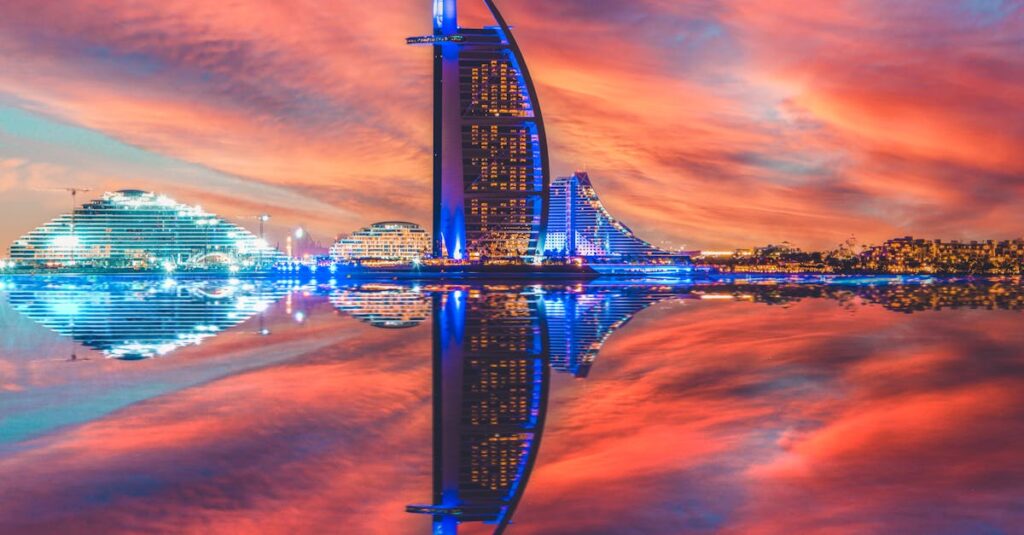 Captivating view of Burj Al Arab reflected in the sea during sunset in Dubai.