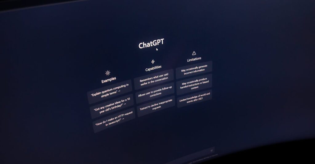 Close-up of a computer screen displaying ChatGPT interface in a dark setting.
