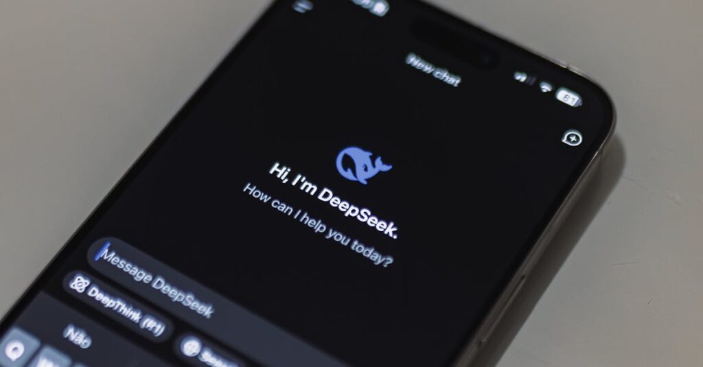 Close-up of smartphone screen showing AI chatbot interface, featuring DeepSeek AI conversation.
