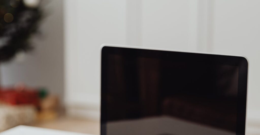 Laptop with dollar bills on desk, capturing a finance and home office theme.