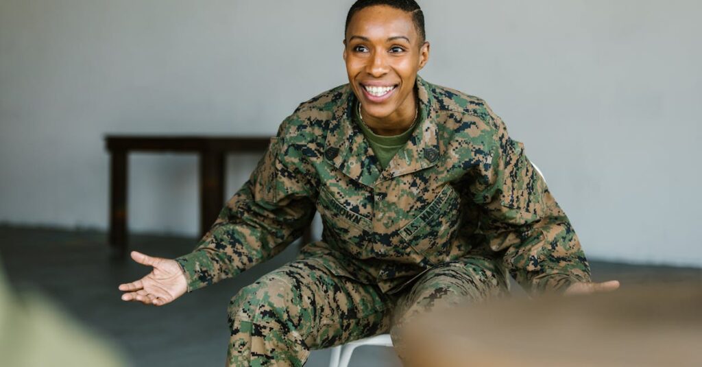 Female soldier in military uniform smiling and gesturing during discussion.