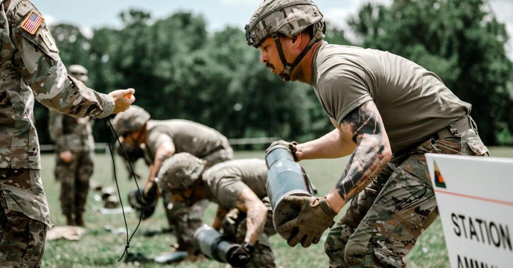 US Army soldiers engage in a rigorous outdoor training exercise at Fort Benning, demonstrating teamwork and discipline.