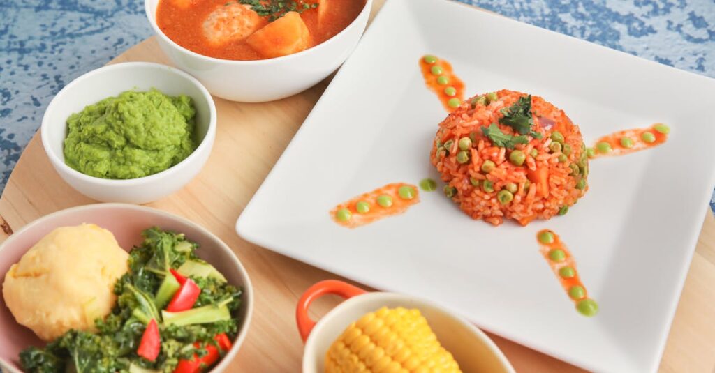 Flat lay of vibrant African dishes including jollof rice and vegetables, ideal for food presentations.