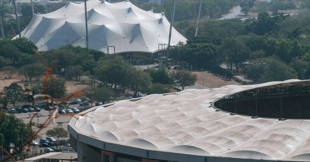 Aerial shot of Abuja, Nigeria highlighting modern architecture and cityscape.