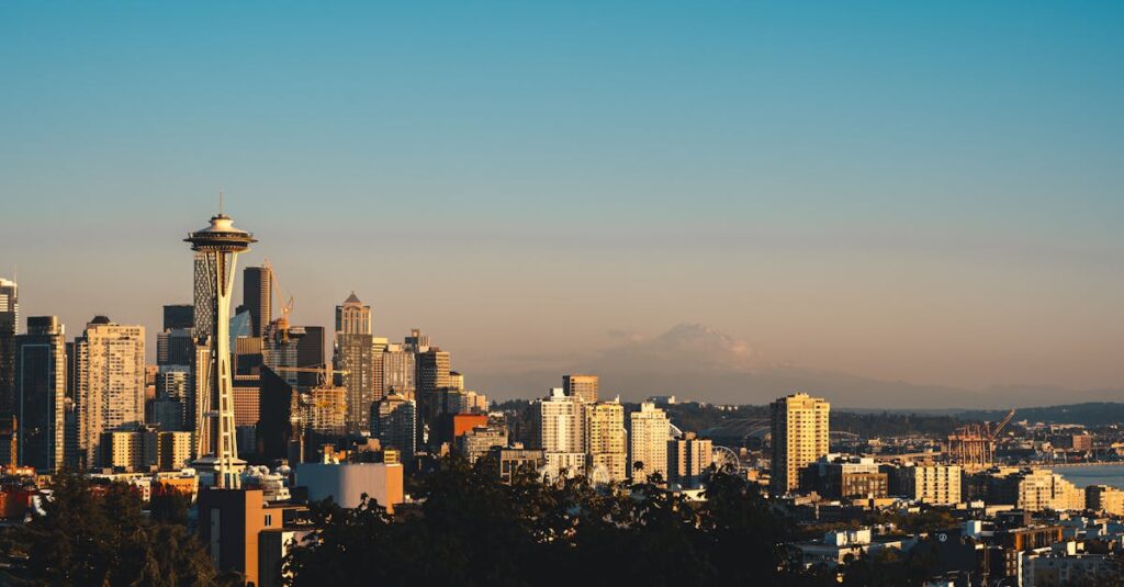 Stunning view of Seattle cityscape with Space Needle at sunset, offering a serene urban landscape.