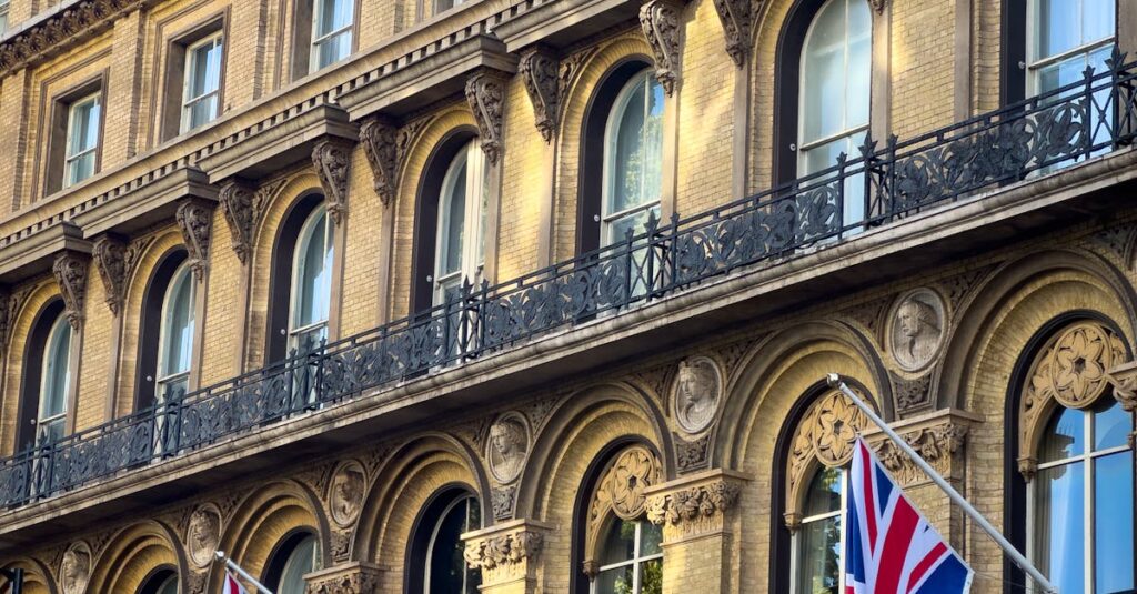 Victorian architecture in London adorned with Union Jack flags. Captures the essence of British elegance and heritage.
