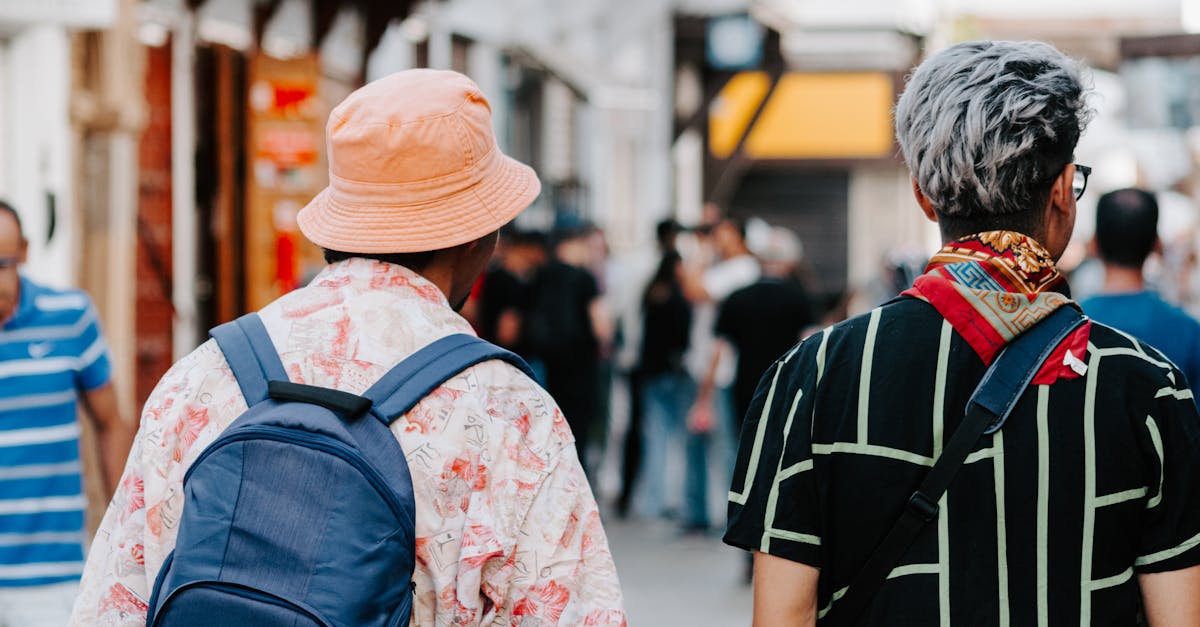 Stylish travelers walking through Rabat's bustling streets, capturing Moroccan urban life.