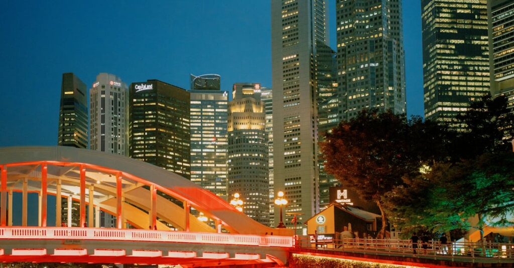 Stunning view of Singapore skyline with vibrant lights reflecting in the water at night.