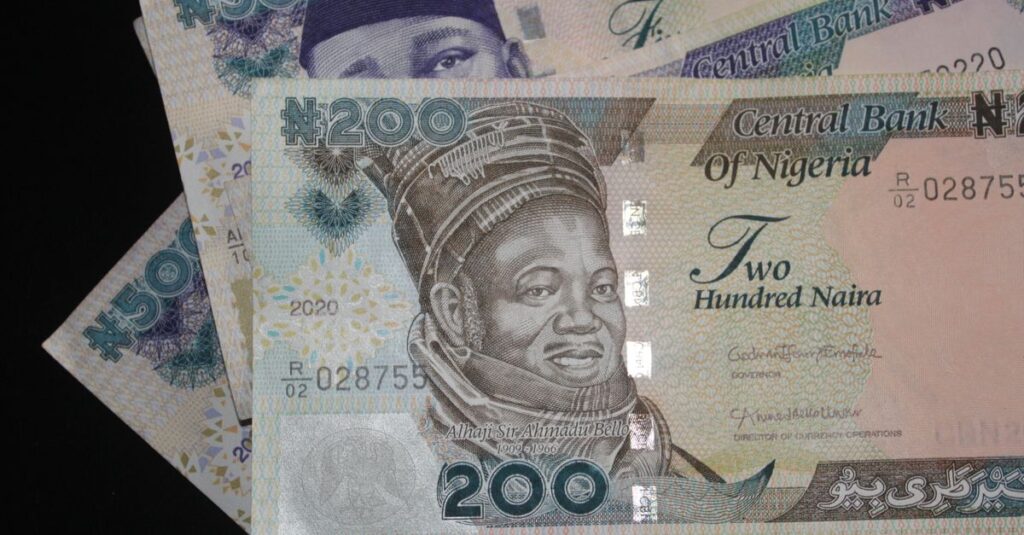 Detailed close-up view of Nigerian naira currency, highlighting N200 and N500 notes.
